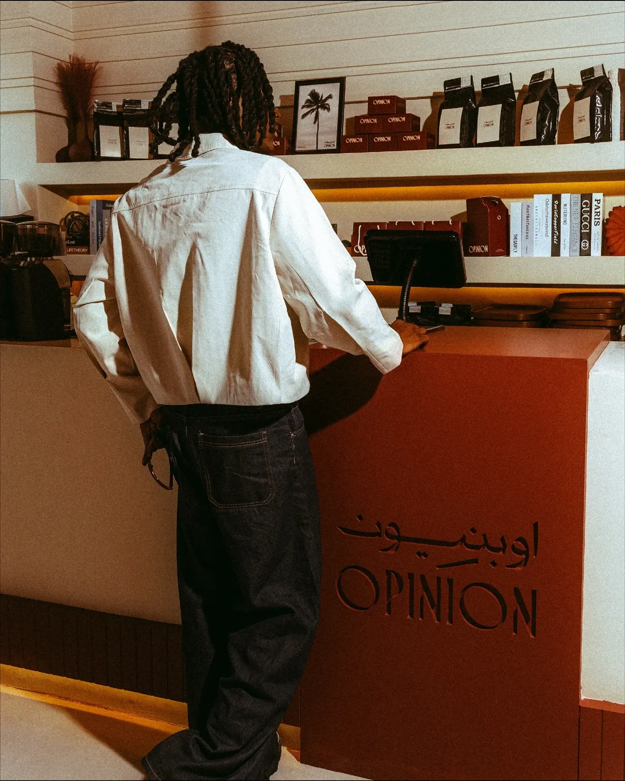 A guest at the burgundy OPINION counter