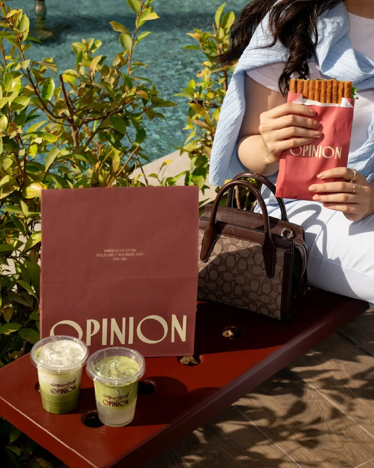 OPINION bag with two matcha drinks outdoors